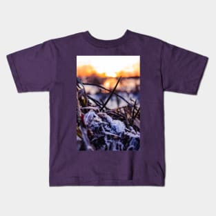 Beautiful frozen leaves on the surface of an icy lake in Scotland Kids T-Shirt